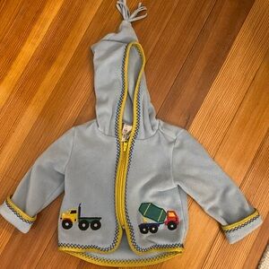 Hanna Andersson Fleece Zip Up with embroidered trucks and stitching. 12-18M